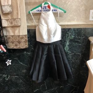 Skater girl dress with high neckline and low back